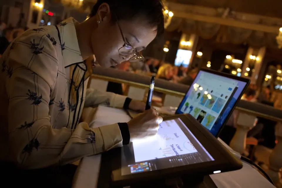 A person sketching a digital visualization, showing the live capture stage of a visual workflow.