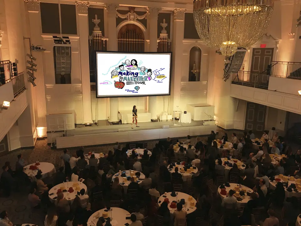 Conference audience viewing a visual change management presentation.