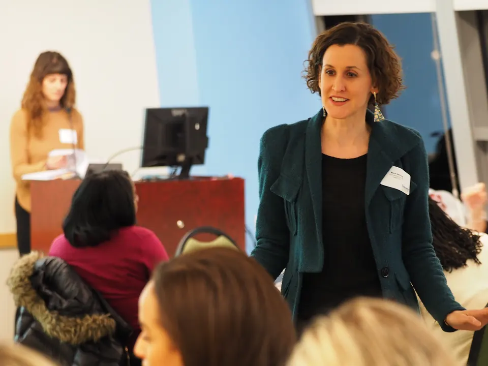 Nora Herting talking with a client