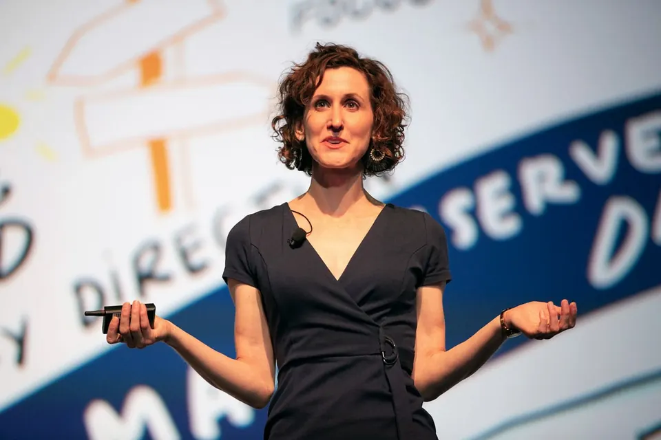 Nora Herting giving a keynote at WBENC 2019 in front of one of her own boards